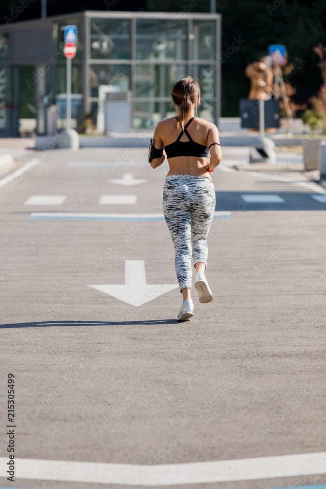 Sporty woman during workout in the city Sporty woman during workout in the city
