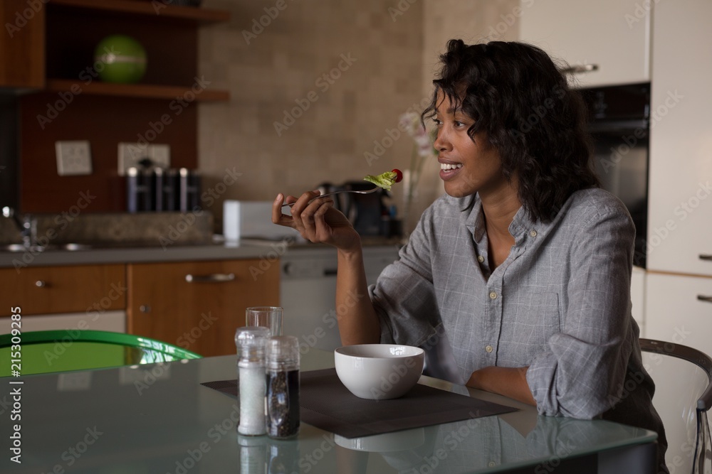 Woman having breakfast at home Woman having breakfast at home
