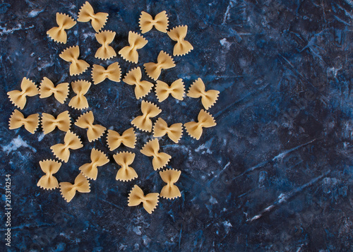 Paste laid out in the form of a flower on a blue textured background. photo