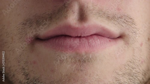 close up young man lips caucasian male mouth unshaved facial hair skin care health