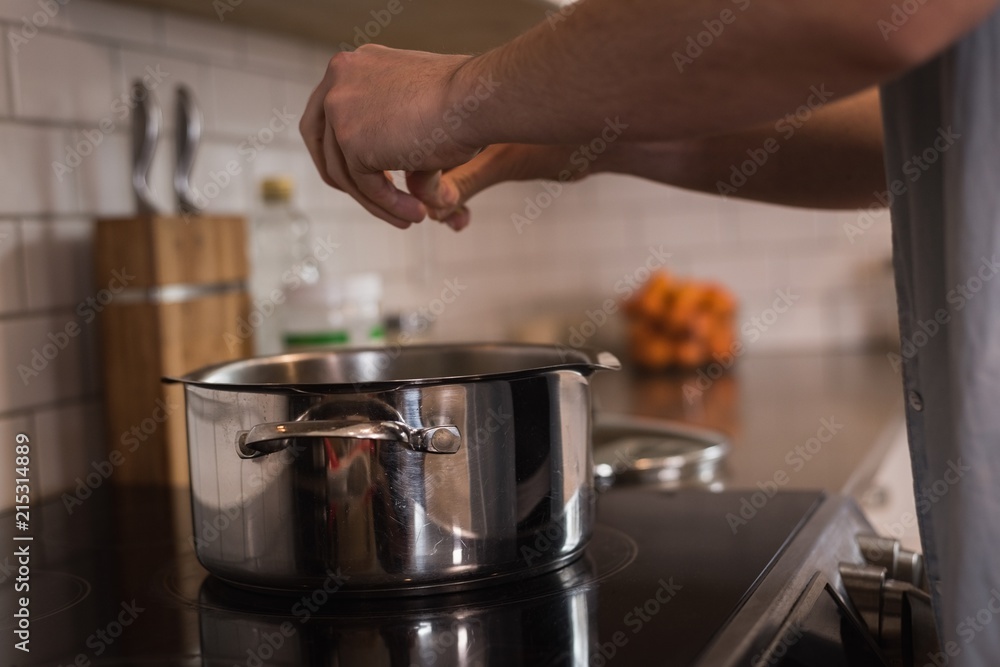 Woman preparing food in the kitchen at home Woman preparing food in the kitchen at home