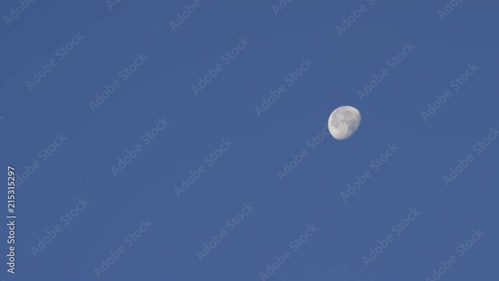 A lone moon in the sky in the morning. A lone moon in the sky in the morning.