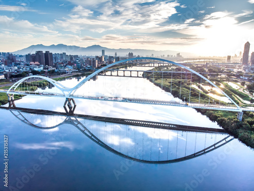 Crescent Bridge - landmark of New Taipei, Taiwan with beautiful illumination at day, aerial photography in New Taipei, Taiwan. photo