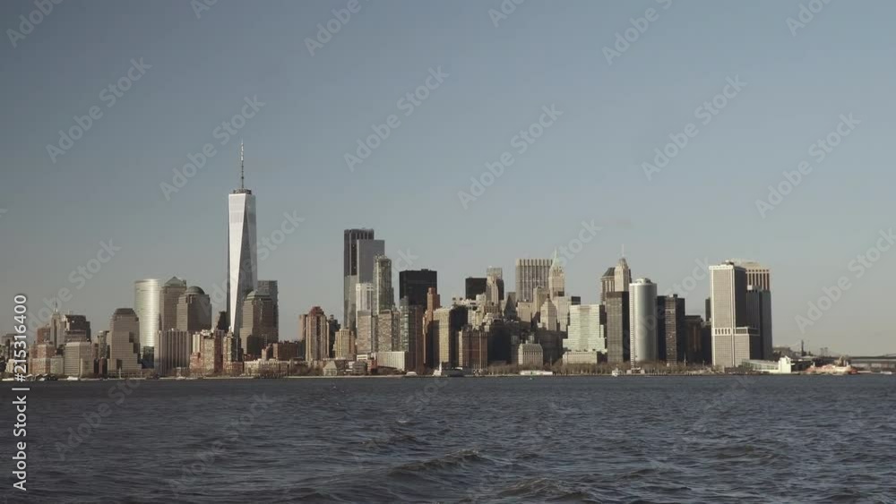 Financial skyscrapers in downtown New York in Lower Manhattan filmed from the south river in late afternoon Financial skyscrapers in downtown New York in Lower Manhattan filmed from the south river in late afternoon