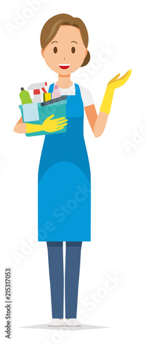 A woman wearing a blue apron and rubber gloves has several cleaning tools. And she is informative.