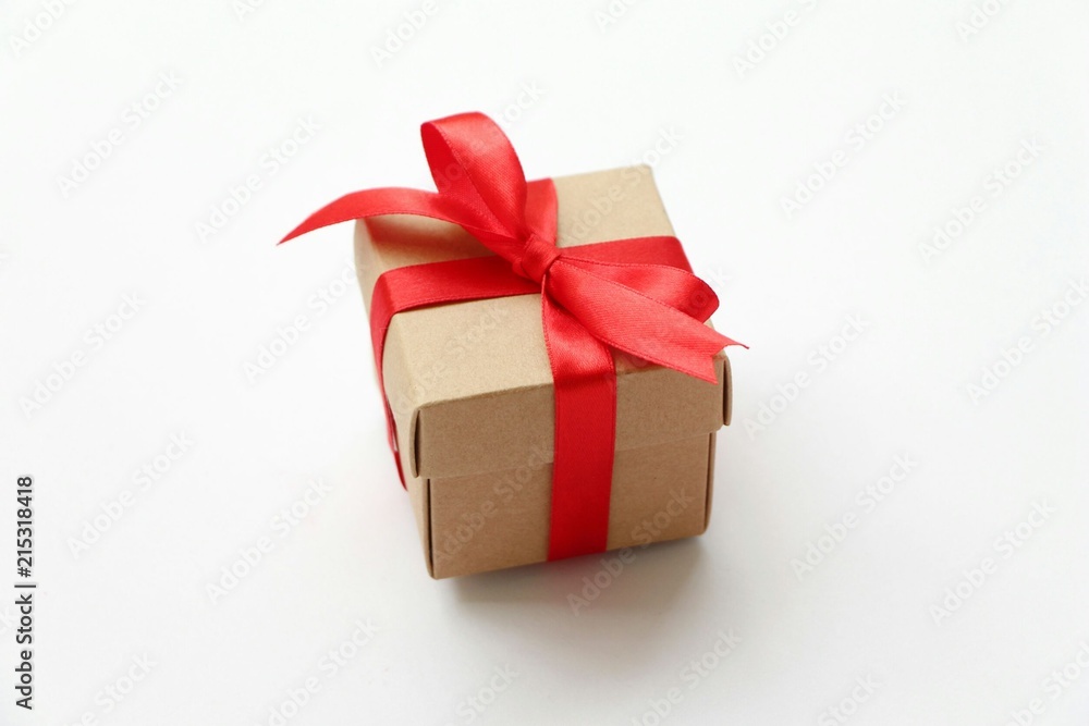 Fototapeta premium Small Gift box red ribbon on white background give for special person,copy space.