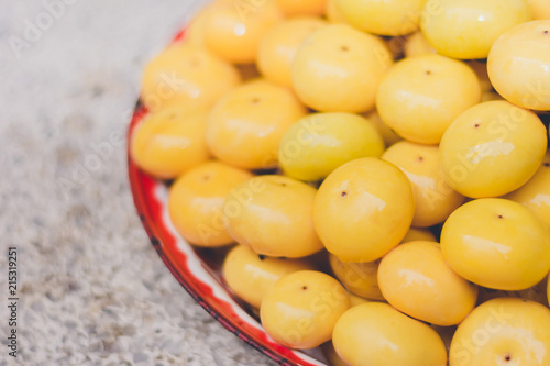 Gold Apple, Diospyros decandra Lour. Thai fruit and Thai herb on tray photo