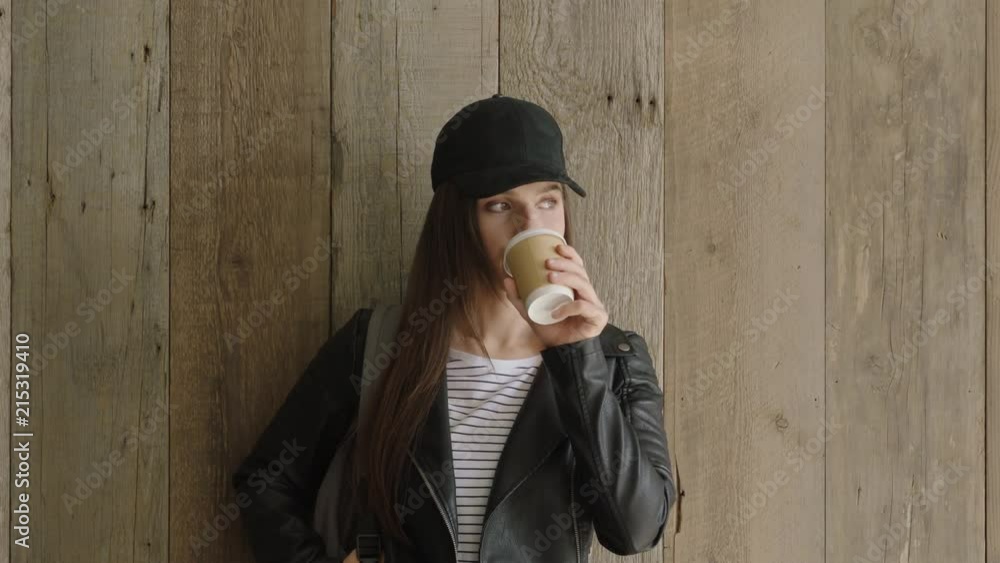 portrait of confident young hispanic woman wearing stylish fashion looking serious drinking coffee relaxed trendy female student portrait of confident young hispanic woman wearing stylish fashion looking serious drinking coffee relaxed trendy female student