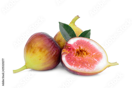 whole and half fig fruit with green leaves isolated on white background
