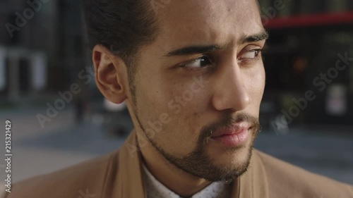Wallpaper Mural close up portrait of young mixed race businessman looking confident at camera turns head serious pensive Torontodigital.ca