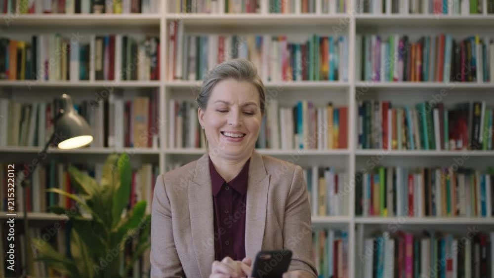 portrait of middle aged business woman executive smiling enjoying texting browsing using smartphone mobile app professional female networking portrait of middle aged business woman executive smiling enjoying texting browsing using smartphone mobile app professional female networking