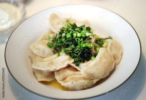 Photo of a bright macro of delicious dumplings with potatoes