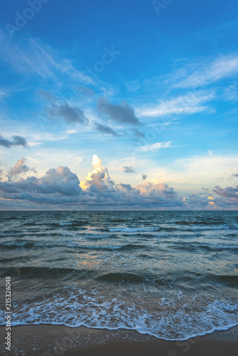  the beach and blue sky on sunny day .