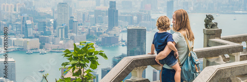 Photography Mom and son travelers at the peak of Victoria against the backdrop of Hong Kong