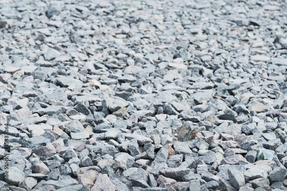 Stone rubble in the construction of the road for vehicles. Textured background Stone rubble in the construction of the road for vehicles. Textured background