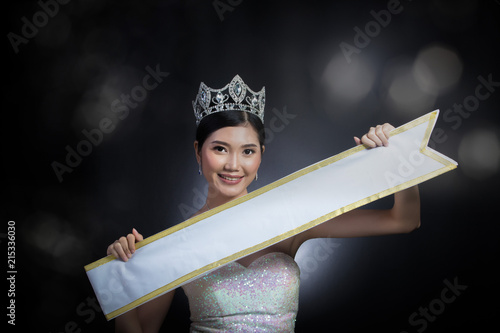 Asian Woman black hair style holding present Empty sash ribbon for country name copy space photo