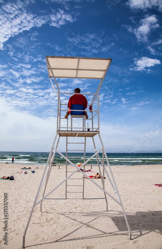 Rescue tower with savior near the sea
