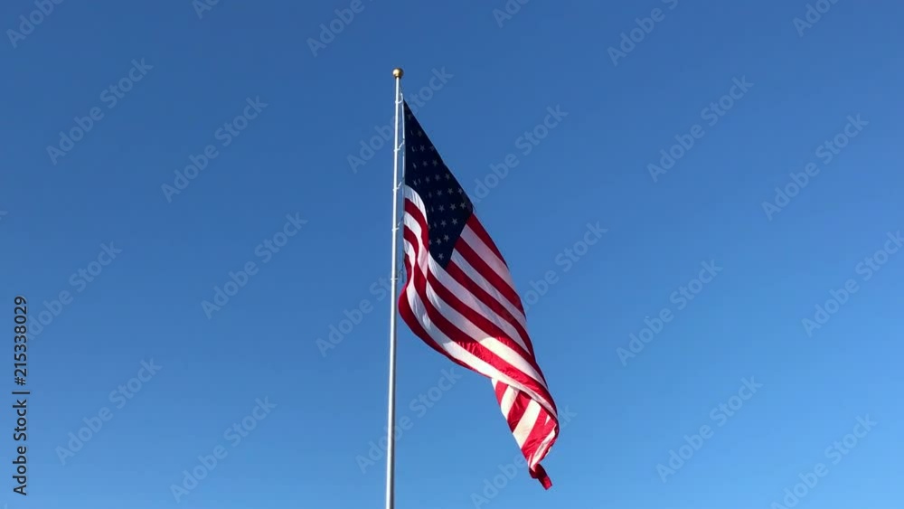 Huge American flag gently waving in the breeze Huge American flag gently waving in the breeze