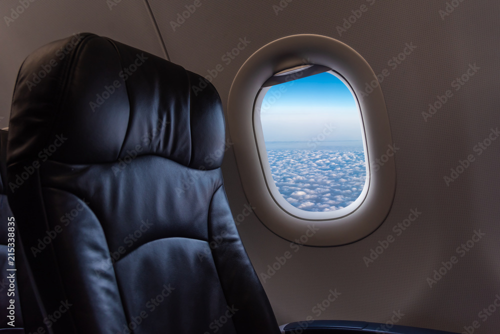 seat and plane window with beautiful blue sky. seat and plane window with beautiful blue sky.