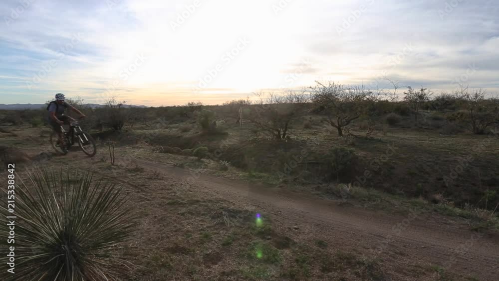 Mountain bikers riding through the desert. Mountain bikers riding through the desert.