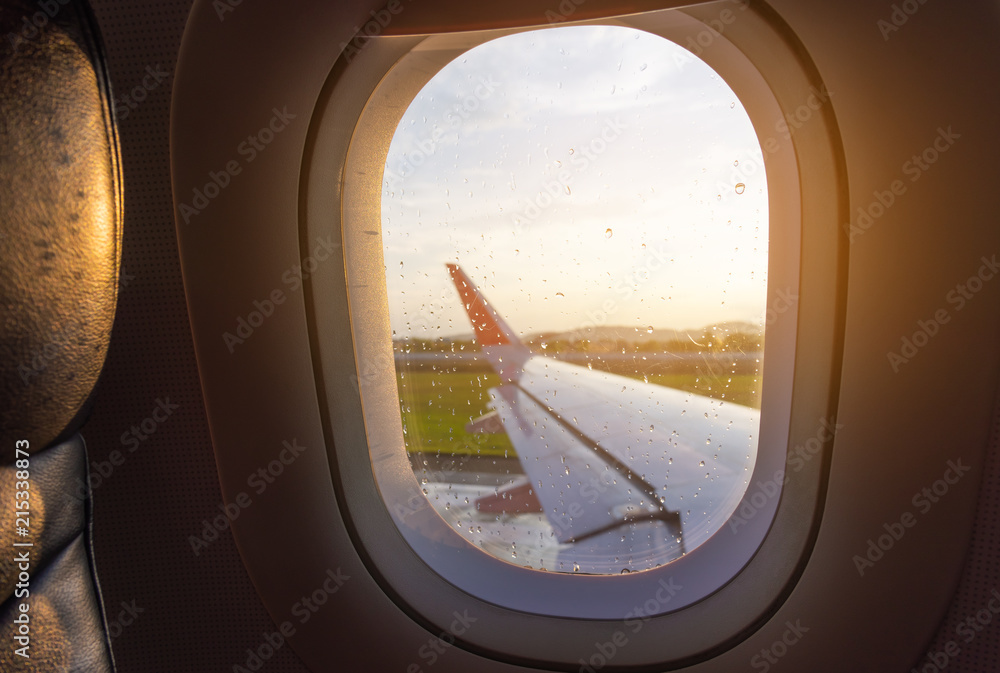 seat and plane window with raindrops. seat and plane window with raindrops.