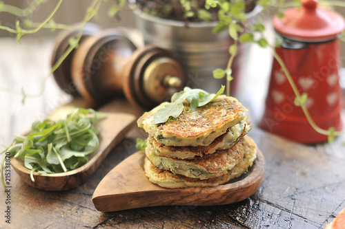 vegetable pancakes for dinner. With spices and herbs. on a brown background