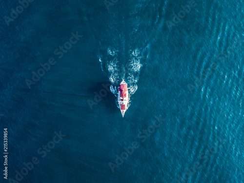 aerial bird eye view from above of beautiful yacht mast in the blue sea lagoon isolated © Mihail