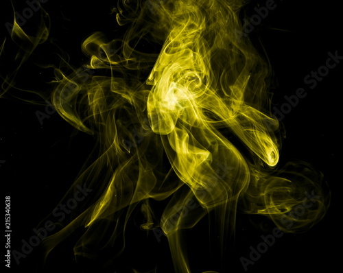Yellow smoke on black background