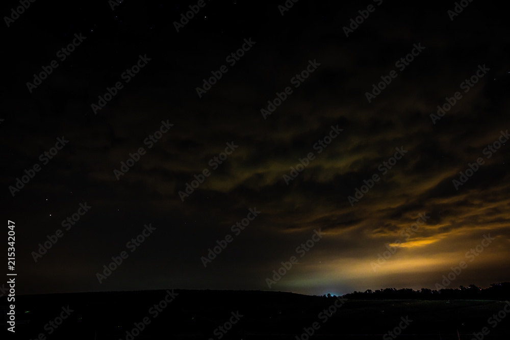 Naklejka premium Reflections on night sky clouds