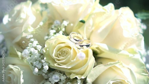 wedding rings on flowers photo