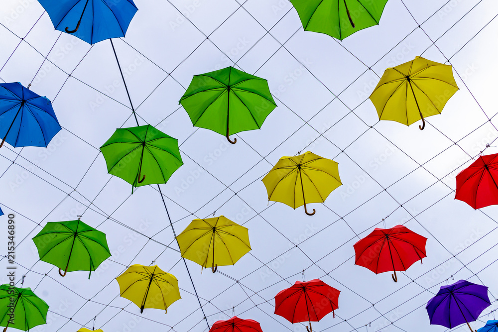 Colorful umbrellas in the sky. Street decoration in Devon, Exeter, UK