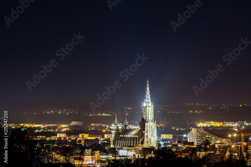 The Ulm cathedral at full moon - a glowing city
