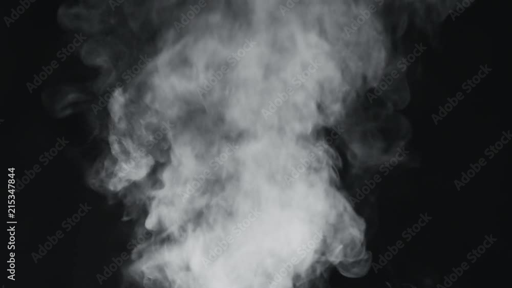 slow motion vapor steam rising over black background slow motion vapor steam rising over black background