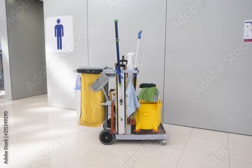 Obraz na plátne Cleaning cart at front of  men toilet