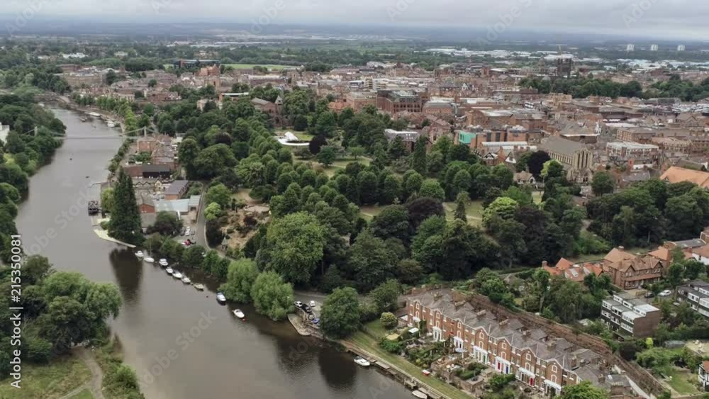 Aerial view, pan move and static. Chester, river Dee, glass building and street traffic Aerial view, pan move and static. Chester, river Dee, glass building and street traffic