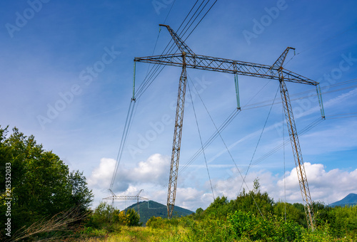 Wallpaper Mural power line tower on a hillside. giant metal construction in beautiful landscape. power and energy concept Torontodigital.ca