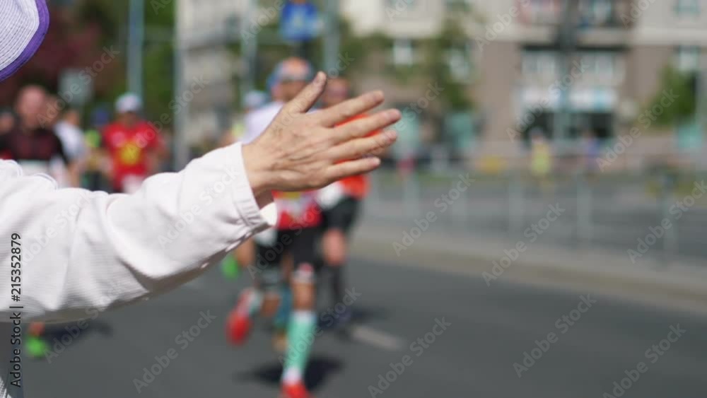 High quality video of giving runners high five in slow motion 180fps High quality video of giving runners high five in slow motion 180fps