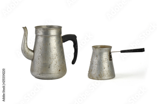 old metal teapot and cezve for turkish coffee isolated on white background