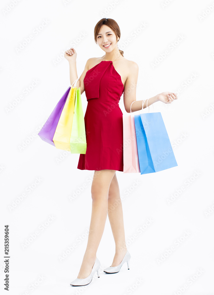 Happy young Woman with shopping bags isolated Happy young Woman with shopping bags isolated