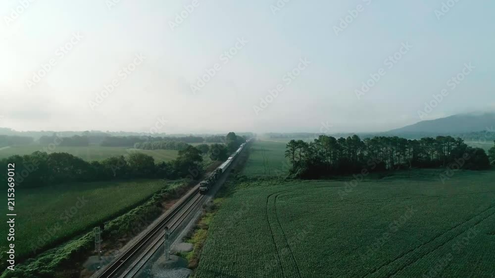 Early morning parked train with fog aerial video flying over. Early morning parked train with fog aerial video flying over.