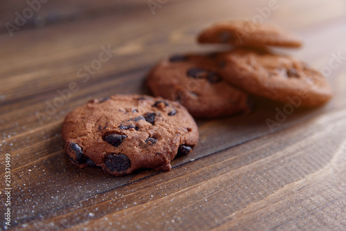 Shortbread cookies with chocolate chips on wooden background. Fresh pastry. Oatmeal cookies for Breakfast.