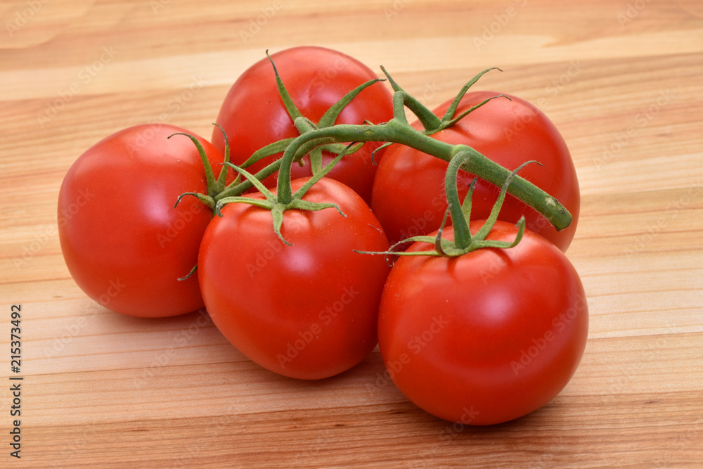 Whole tomatoes on the table. Whole tomatoes on the table.