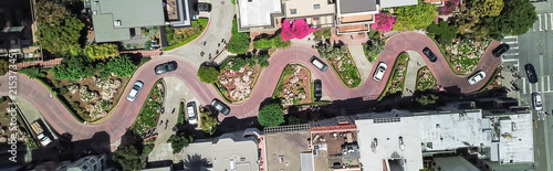 Panorama view aerial Lombard Street, an east–west street in San Francisco, California. Famous for steep, one-block section with eight hairpin turns. Crookedest, steep hills, sharp curves, one-way road