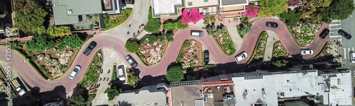 Panorama view aerial Lombard Street, an east–west street in San Francisco, California. Famous for steep, one-block section with eight hairpin turns. Crookedest, steep hills, sharp curves, one-way road photo