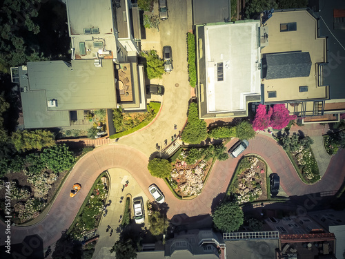 Panorama view aerial Lombard Street, an east–west street in San Francisco, California. Famous for steep, one-block section with eight hairpin turns. Crookedest, steep hills, sharp curves, one-way road