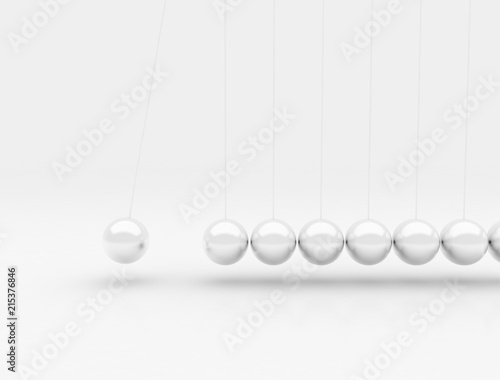 Newtons cradle bright metallic chrome balls in motion