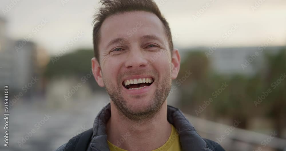 close up portrait happy young man tourist laughing enjoying successful vacation travel independent caucasian male in city waterfront close up portrait happy young man tourist laughing enjoying successful vacation travel independent caucasian male in city waterfront