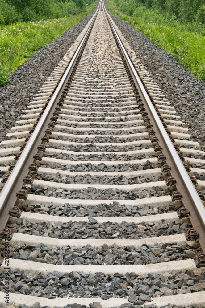 Railroad tracks leading through rural landscape. Railroad tracks leading through rural landscape.