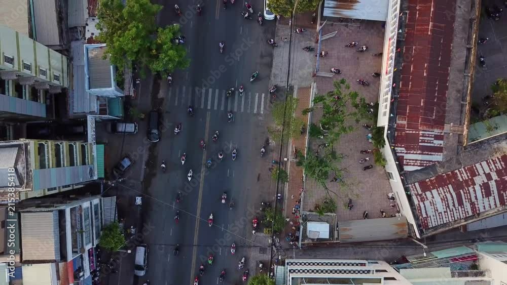 Looking down on motor bikes and cars on the road in Asia Looking down on motor bikes and cars on the road in Asia