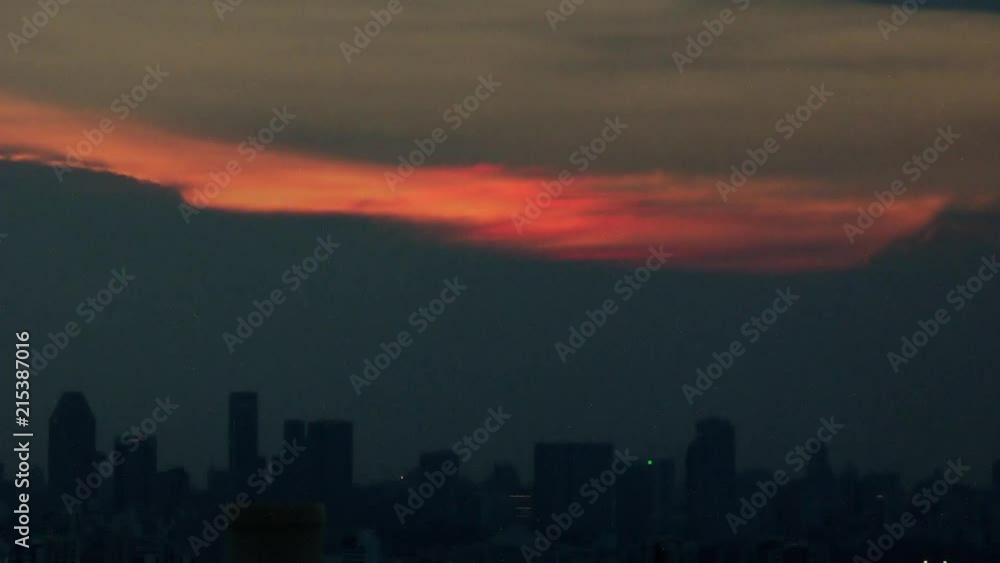 Timelapse day to night of sunset over city skyline Singapore Asia Timelapse day to night of sunset over city skyline Singapore Asia